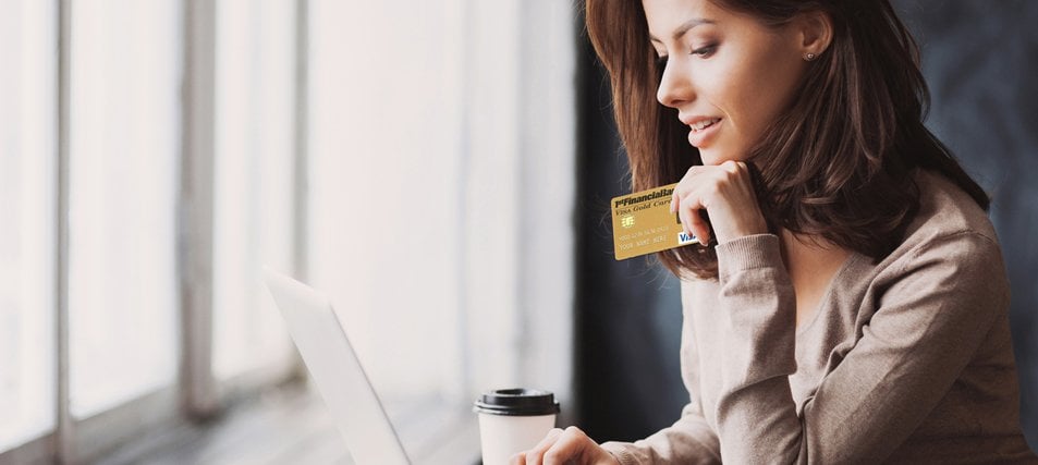 female student with a credit card on computer