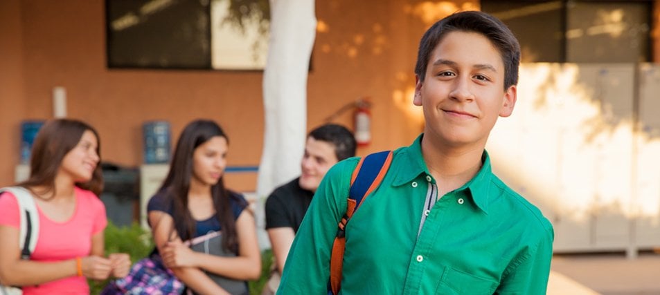 male student in front of three students