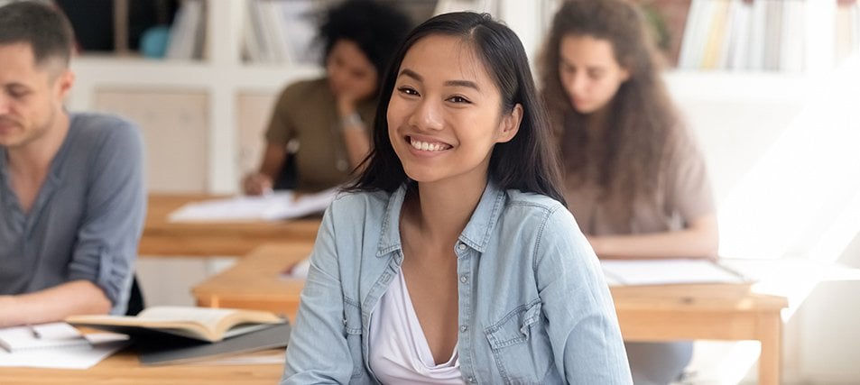 female student smiling in class