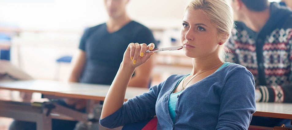 female student thinking in class