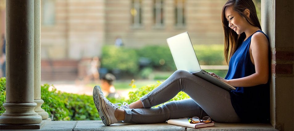 female student studying on campus