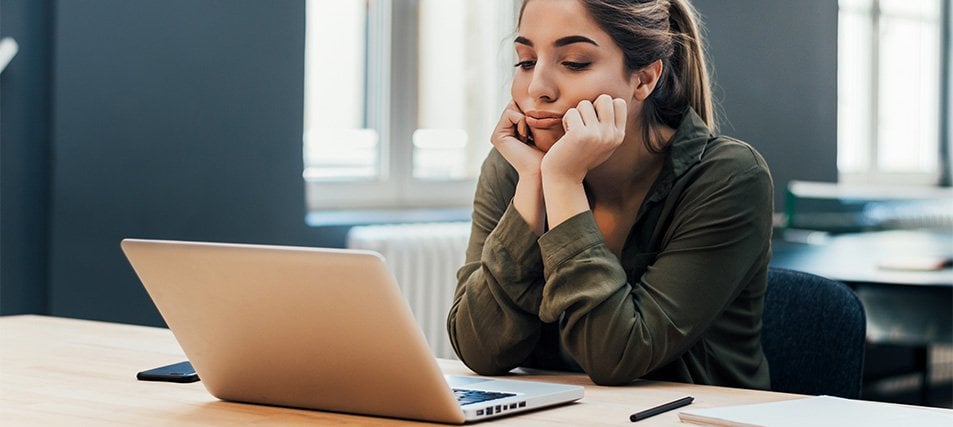 female student frowning on laptop