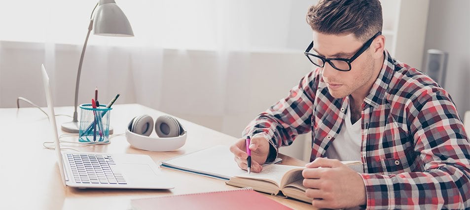 male student taking an exam