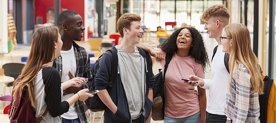 College students laughing in the cafeteria