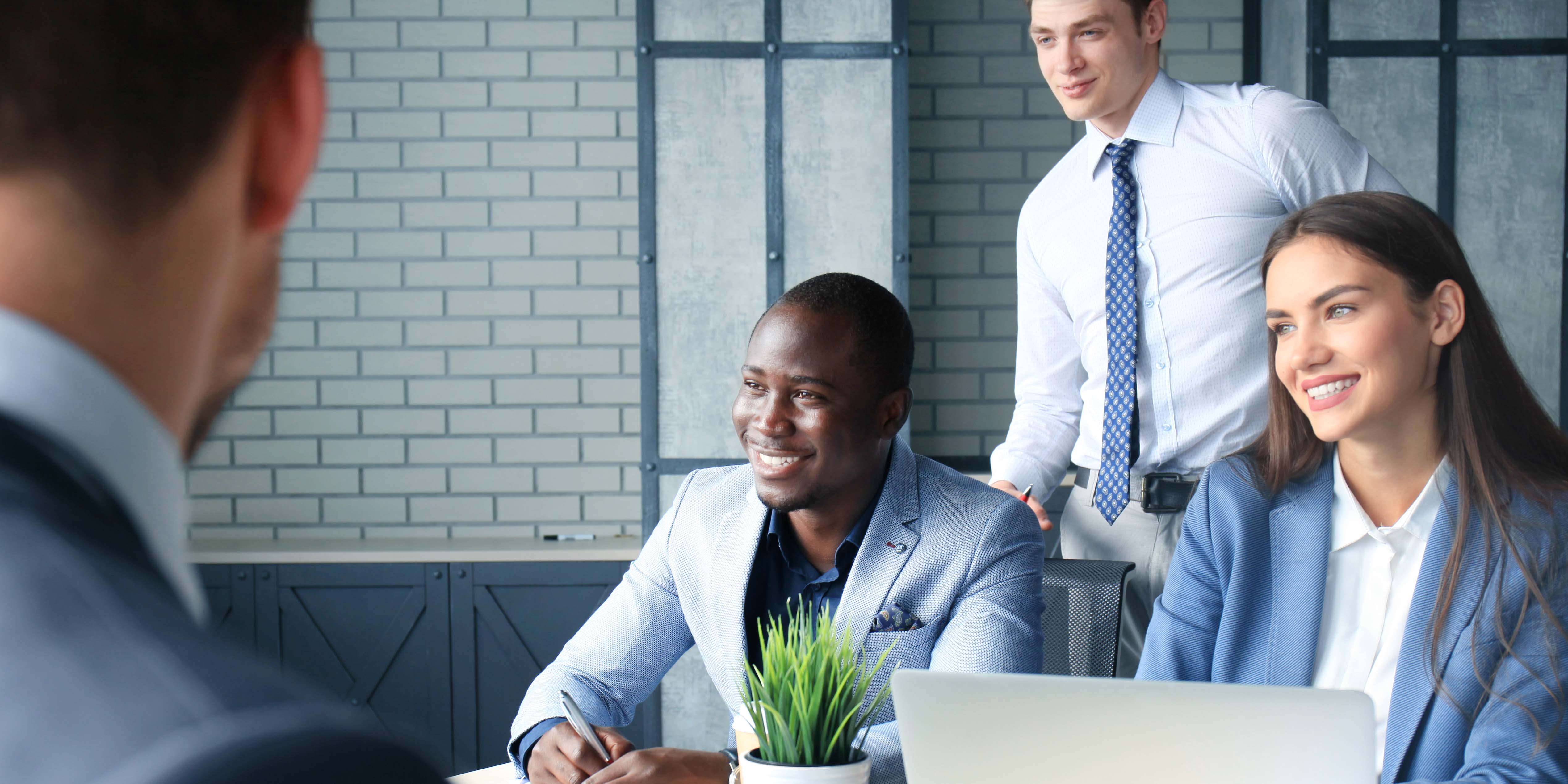 College students in business attire doing a mock interview with career coach