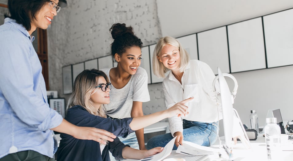 Creative team looking at image on computer